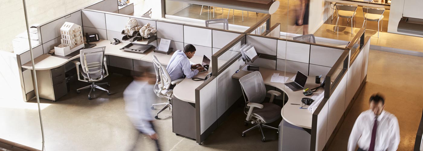 A busy office bullpen as seen from overhead