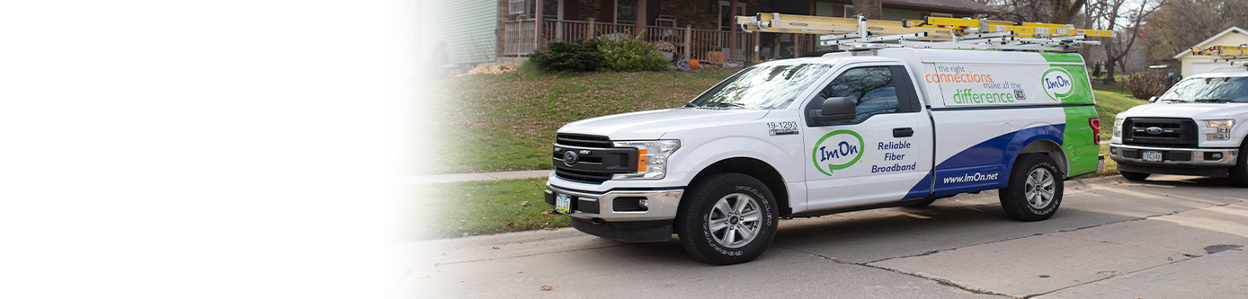 ImOn install trucks lined up in a local neighborhood.