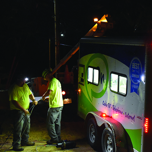 ImOn service technicians pulling fiber cable during maintenance window at night.