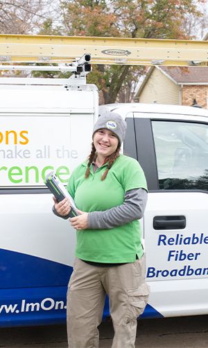 300x500-Thumbnail-Image-Resdiential-Women Tech in front of truck looking at camera.jpg