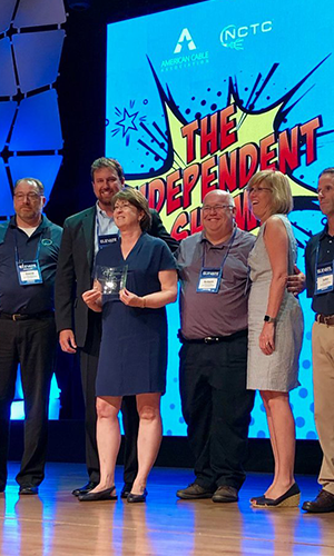 300x500-Thumbnail-Image-Patrice-and-employees-receiving-CableFax-Award-2018.png